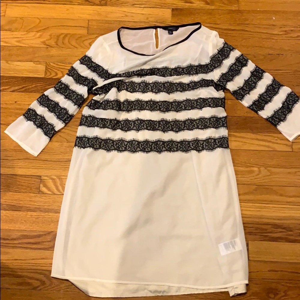 White dress with black lace embellishment